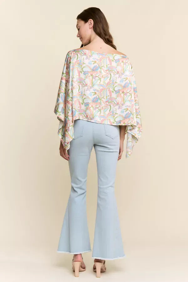 J.NNA Sunset Palm Drape Top featuring a flowy fabric with sunset and palm tree print, stylish and comfortable women&