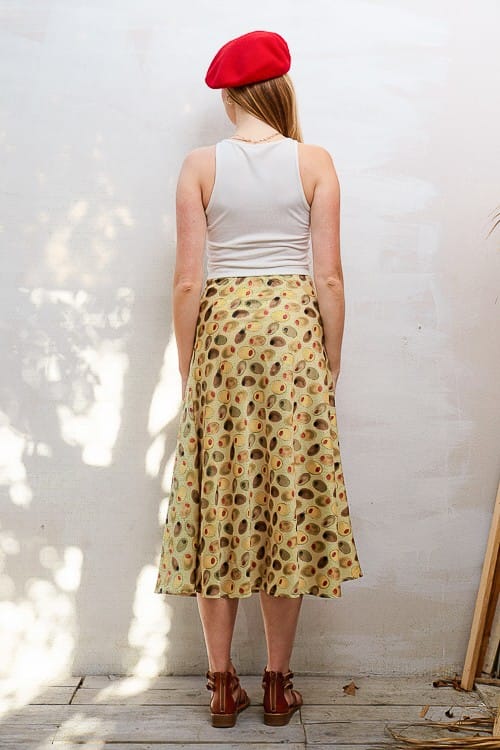 Kiana Olive Midi Skirt by Jade by Jane, flowing midi length skirt in olive green fabric, styled with a casual top.