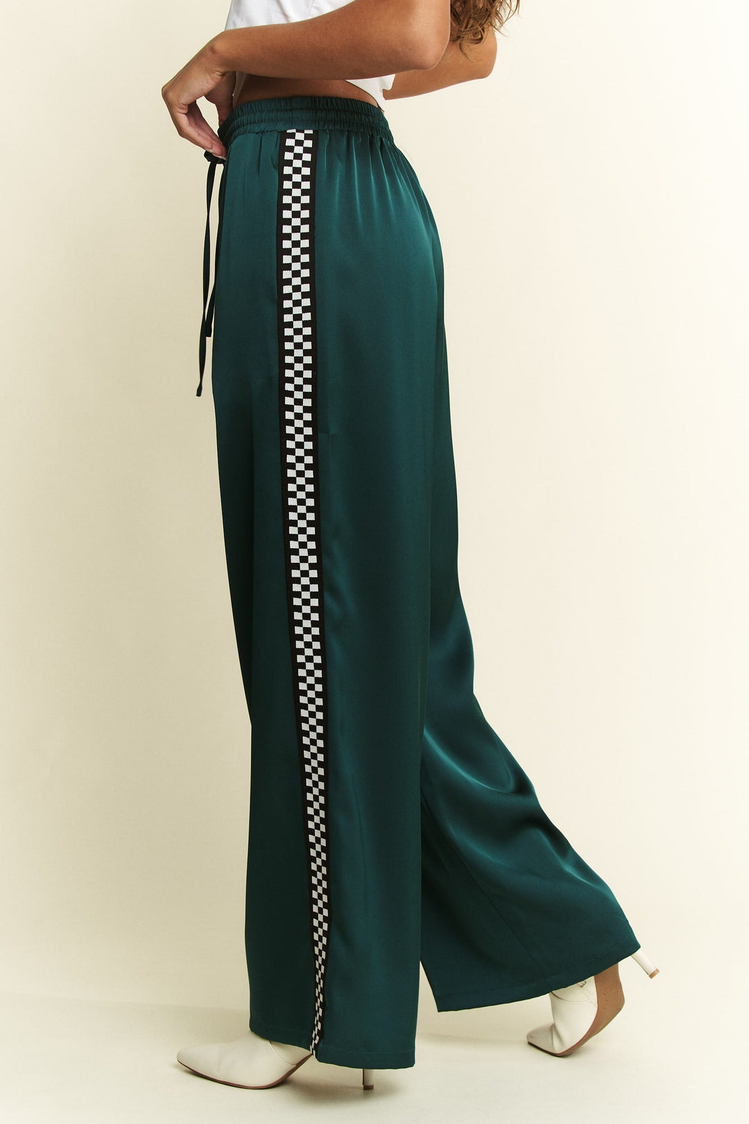 Jade by Jane Isabel satin sweatpants in soft fabric, showcasing relaxed fit and stylish design on a neutral background.