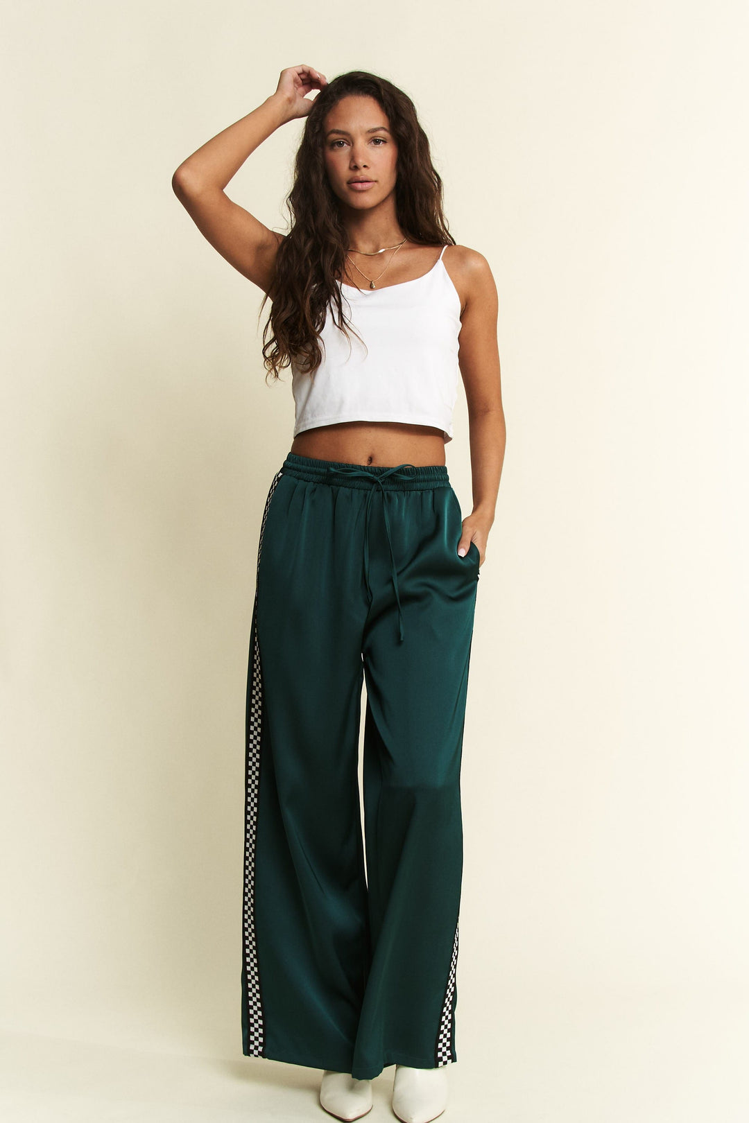 Jade by Jane Isabel satin sweatpants with a relaxed fit and elastic waistband, shown in a soft satin fabric.