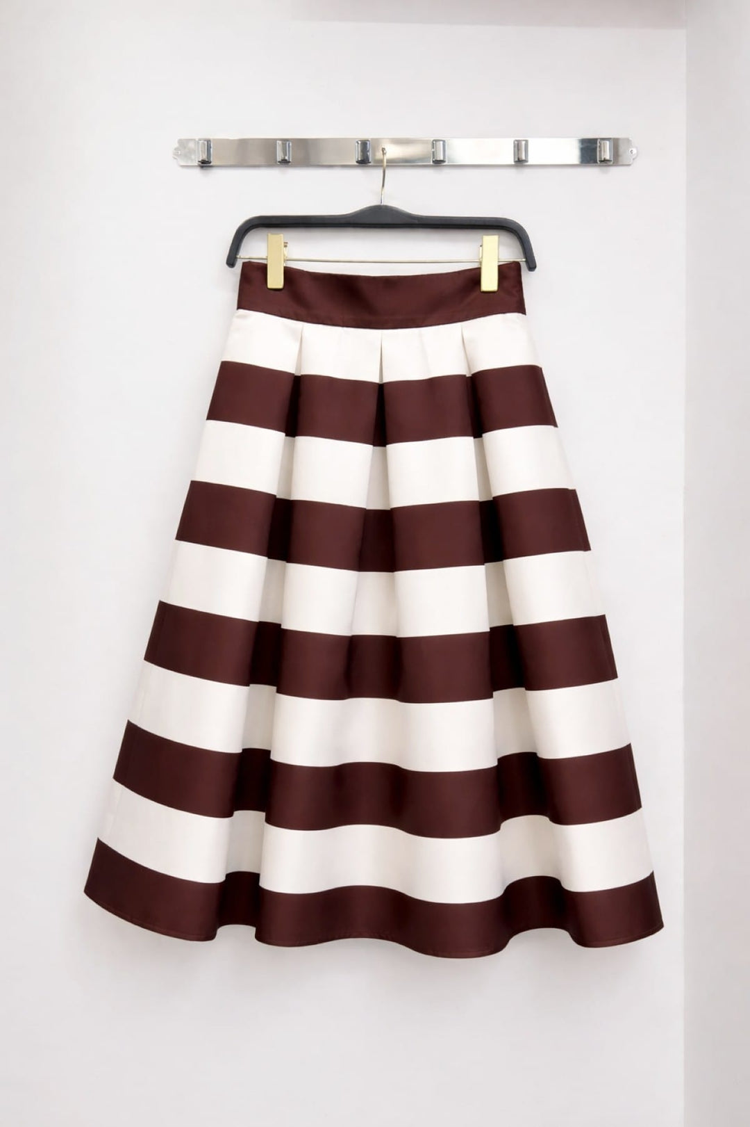 Jade by Jane Piper Pleated Midi Skirt featuring light fabric and elegant pleats, styled for a chic, sophisticated look.