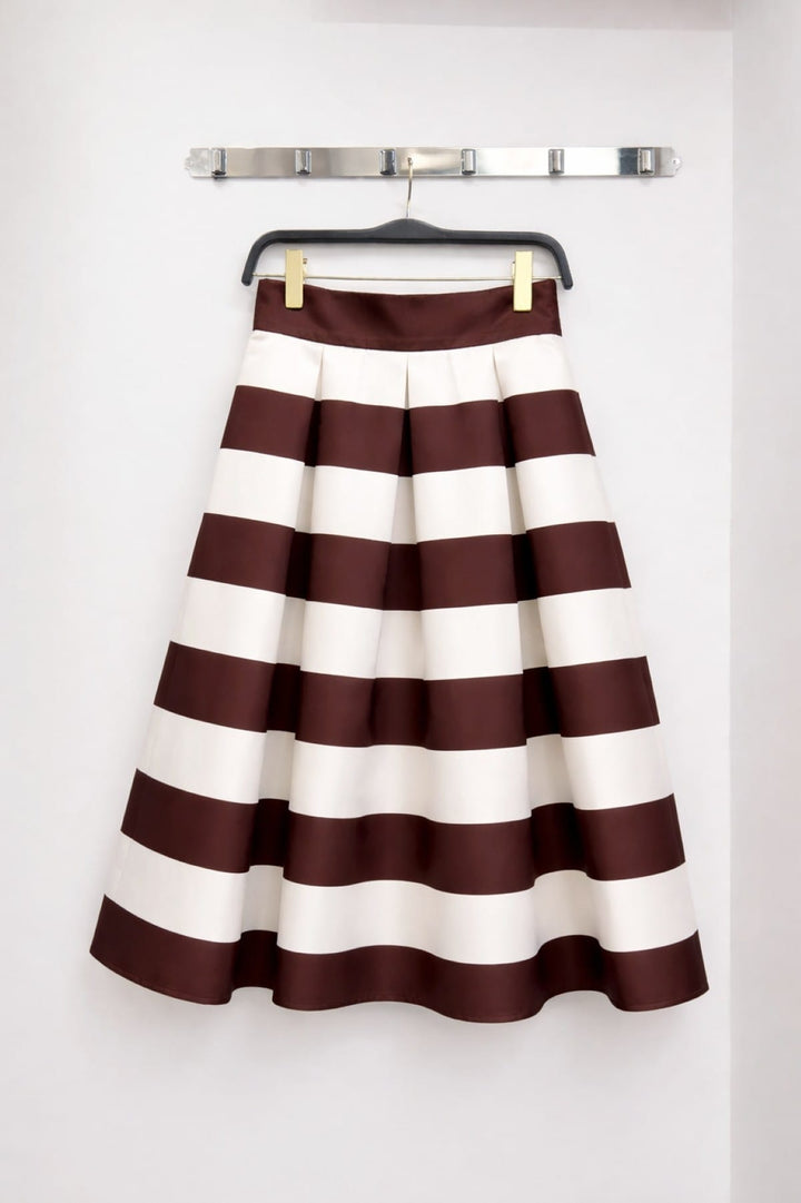 Jade by Jane Piper Pleated Midi Skirt featuring light fabric and elegant pleats, styled for a chic, sophisticated look.