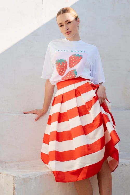 Jade by Jane Piper pleated midi skirt shown in a natural waist style with soft pleats and a flowy silhouette.