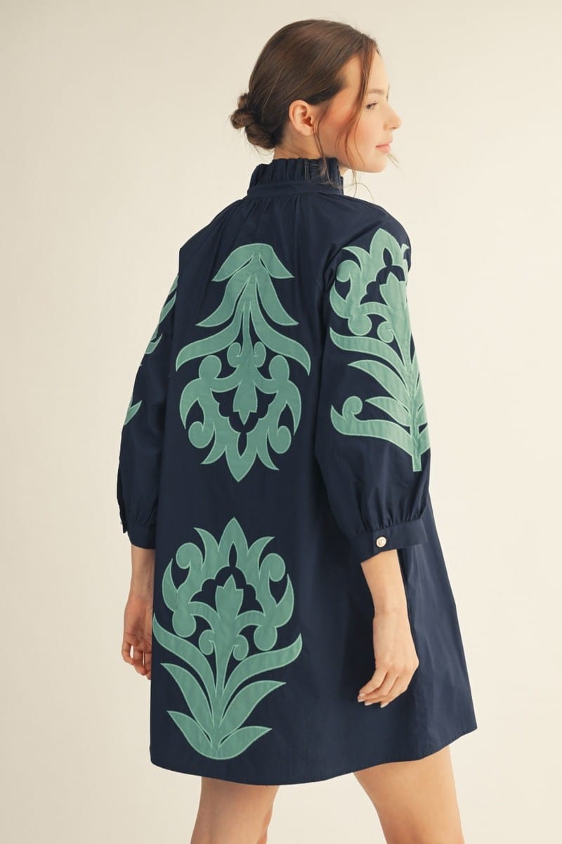 Jodifl Jocelyn floral shift dress in mini length with vibrant floral print, sleeveless design, and round neckline.