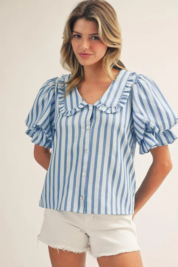 Blue Gabriela Puff Sleeve Top by Jodifl featuring puffed sleeves and a relaxed fit, displayed on a hanger.