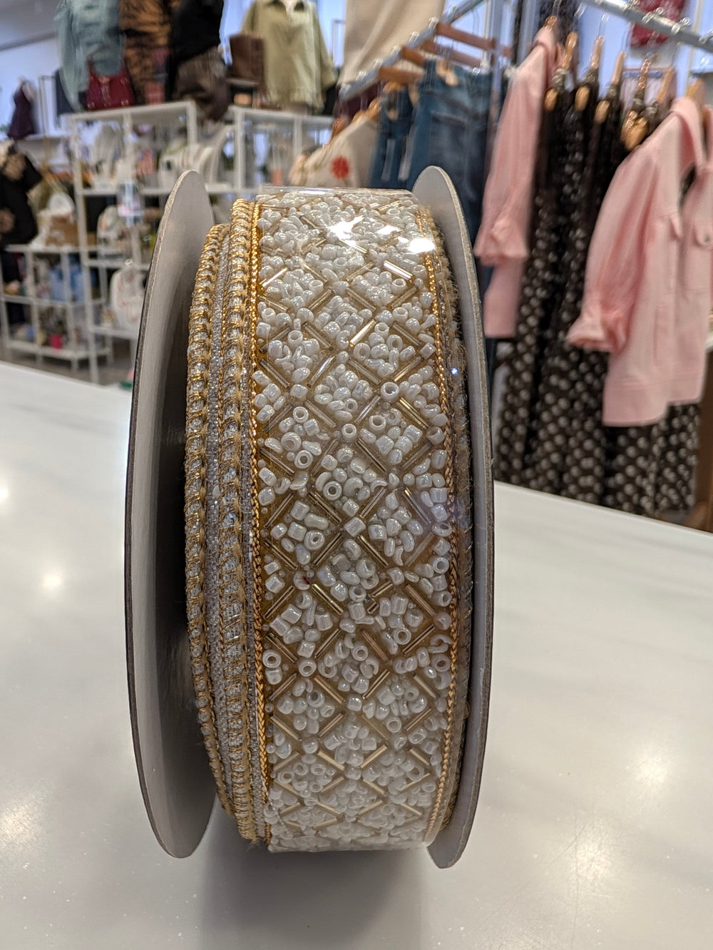 Beaded metallic ivory and gold decorative ribbon by John Mark Enterprises, perfect for elegant home decor.