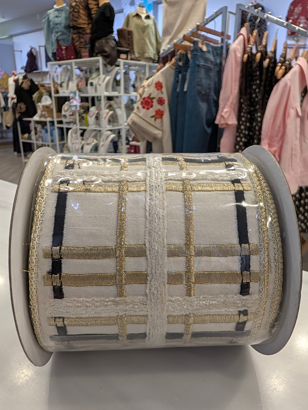 Ivory and gold embroidered John Mark Ribbon decor with black plaid pattern, suitable for decorating or craft projects.