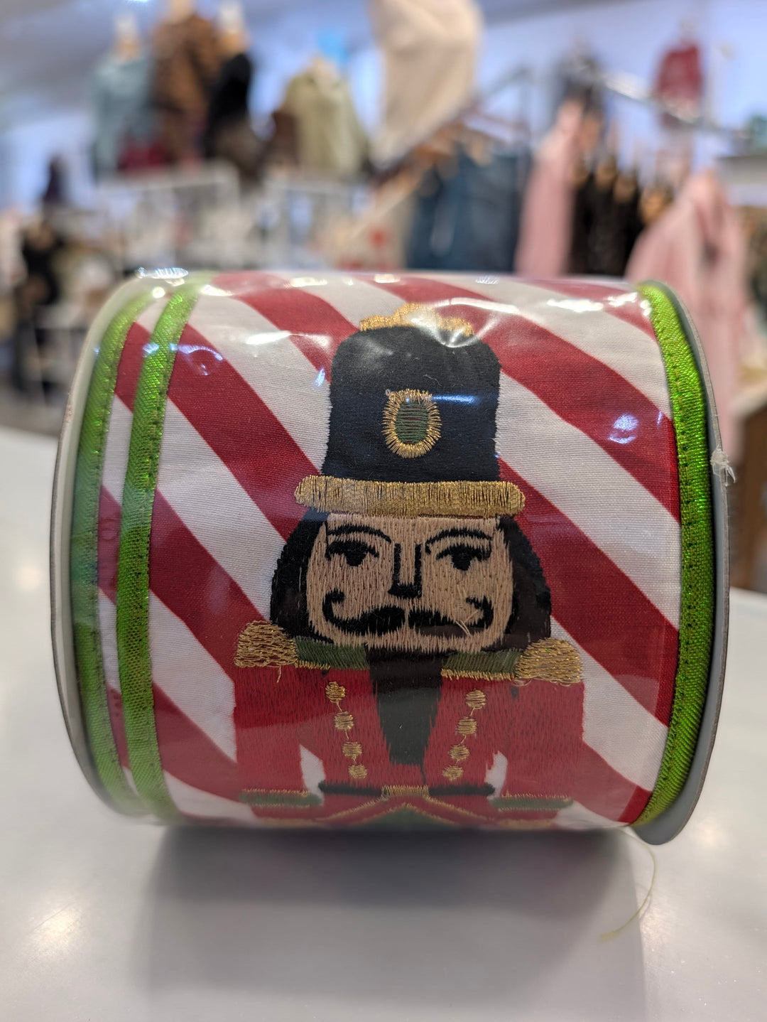 Decor featuring a John Mark Ribbon with a nutcracker print and metallic finish, made by John Mark Enterprises.
