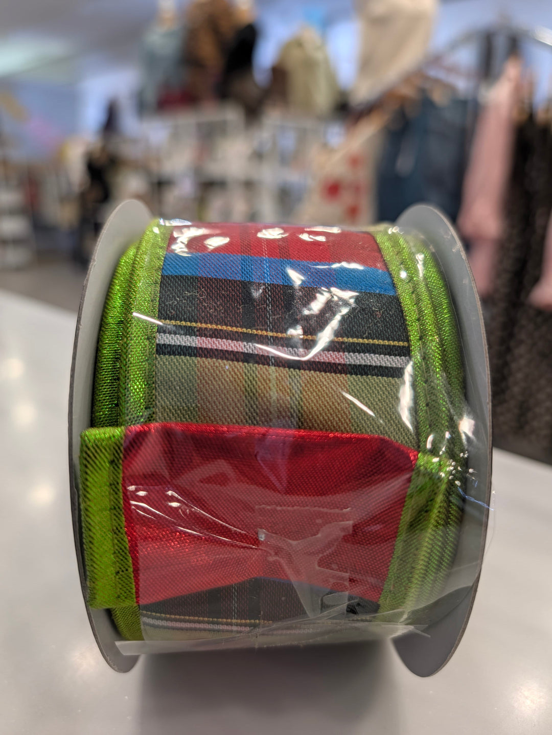 Red and green metallic stripe ribbon from John Mark Enterprises, decorative fabric perfect for crafts and gift wrapping.