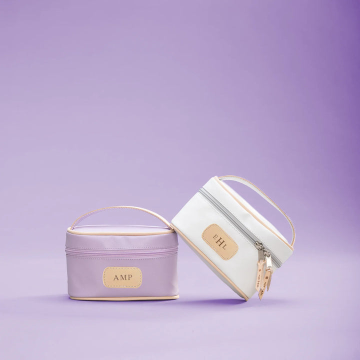Jon Hart Design mini makeup case in a compact makeup bag with a zipper closure, featuring a stylish, functional design.