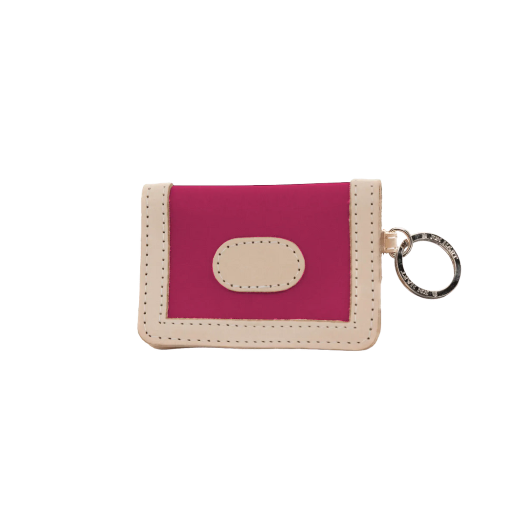 Jon Hart Design ID wallet made of berry-coated canvas, featuring multiple card slots and a secure ID window.