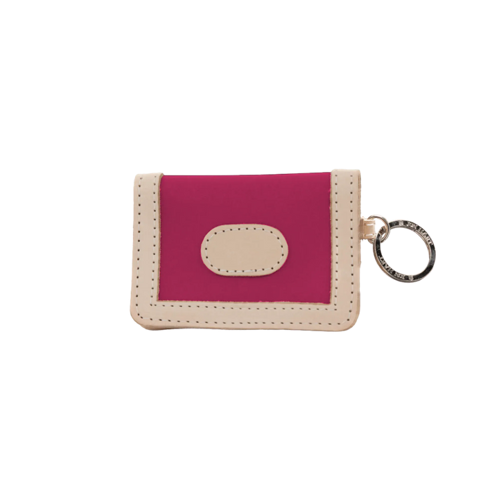 Jon Hart Design ID wallet made of berry-coated canvas, featuring multiple card slots and a secure ID window.