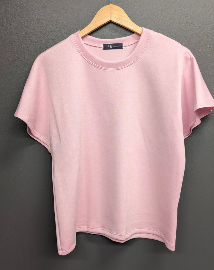 Pink Alessia Flared Top by KLd. Signature, featuring a stylish flared design and fitted silhouette, shown on a model.
