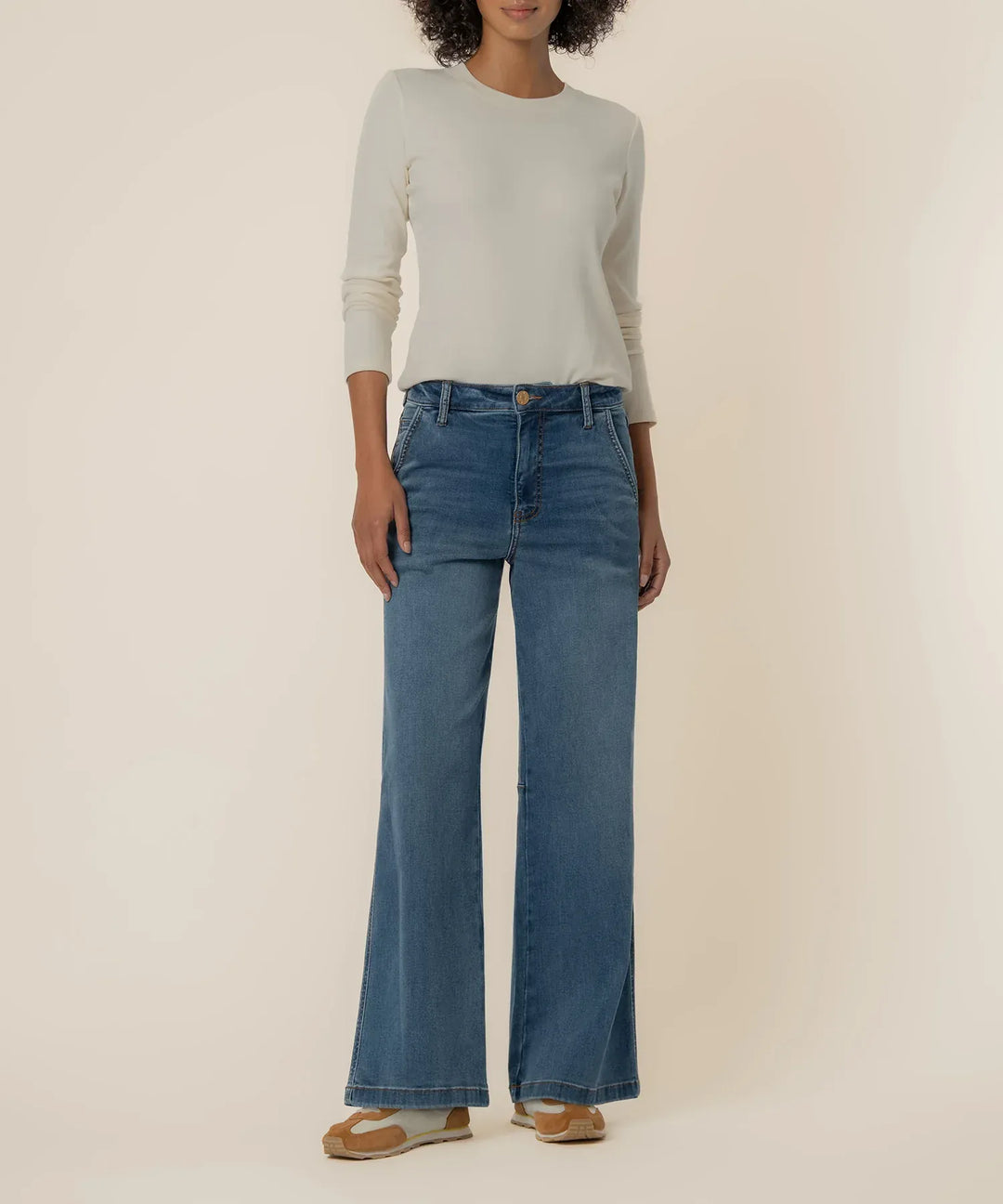 KUT from the Kloth Meg High Rise Wide Leg Denim jeans with a light wash and relaxed fit, shown on a model.