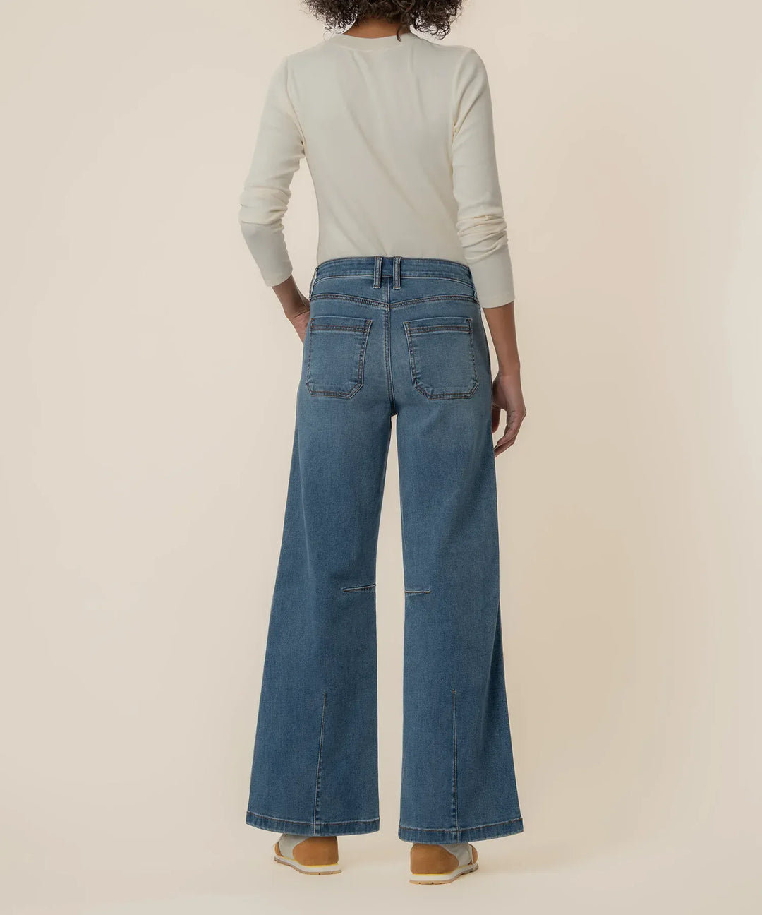 KUT from the Kloth Meg high-rise wide-leg denim jeans, front view showcasing the fit and classic blue denim fabric.