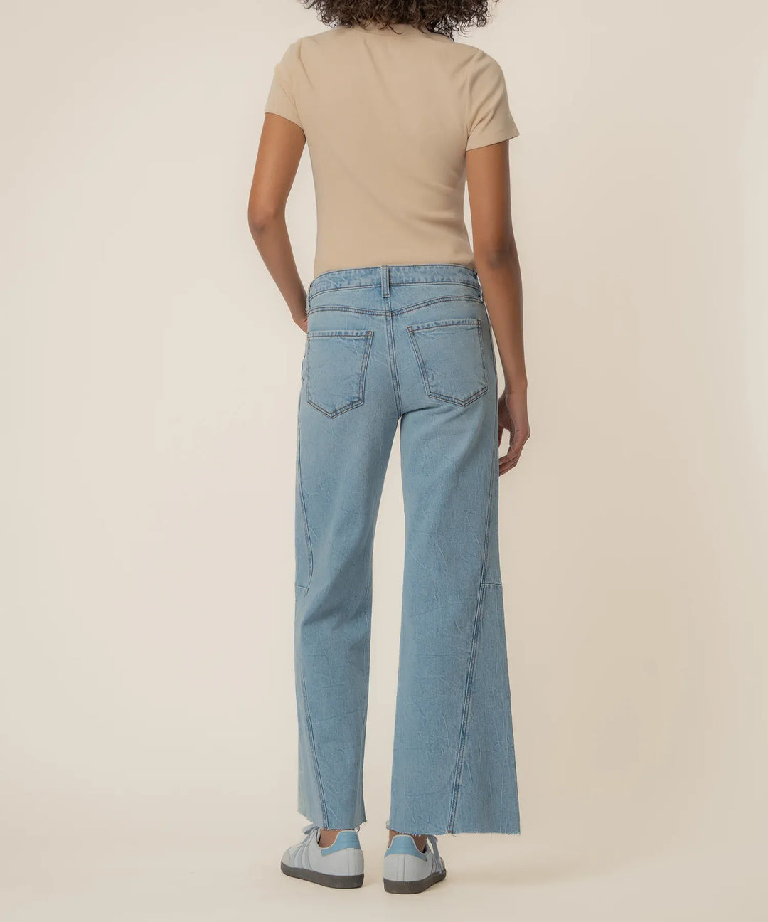 KUT from the Kloth Meg high-rise wide-leg denim jeans, long length, showing the fit and style of the stylish blue denim pants.