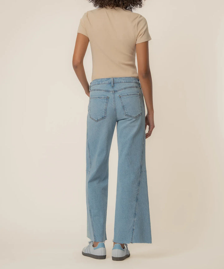KUT from the Kloth Meg high-rise wide-leg denim jeans, long length, showing the fit and style of the stylish blue denim pants.