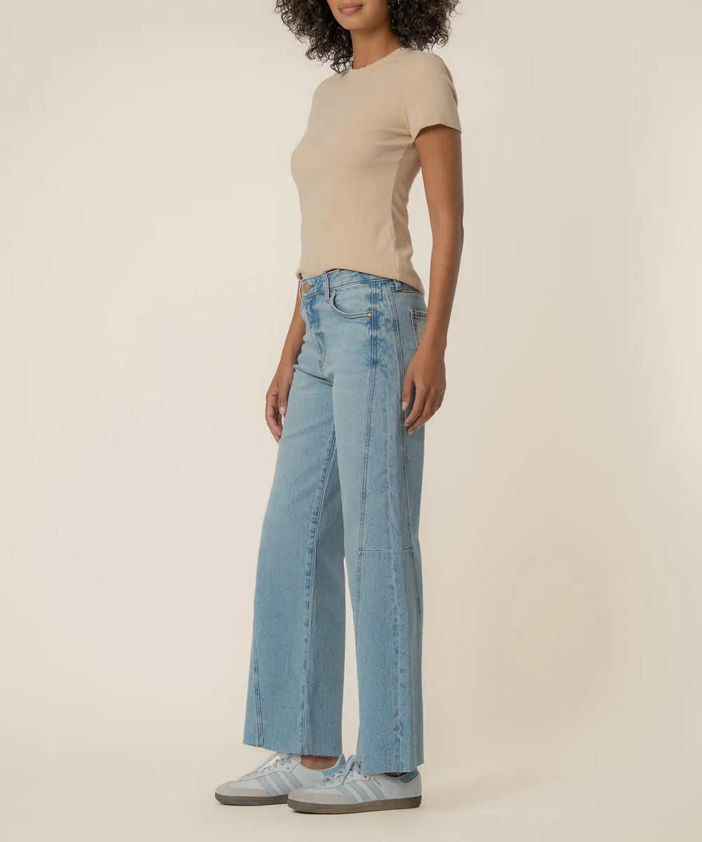 KUT from the Kloth Meg high-rise wide-leg denim jeans in long length, showing the fit and classic blue denim fabric.