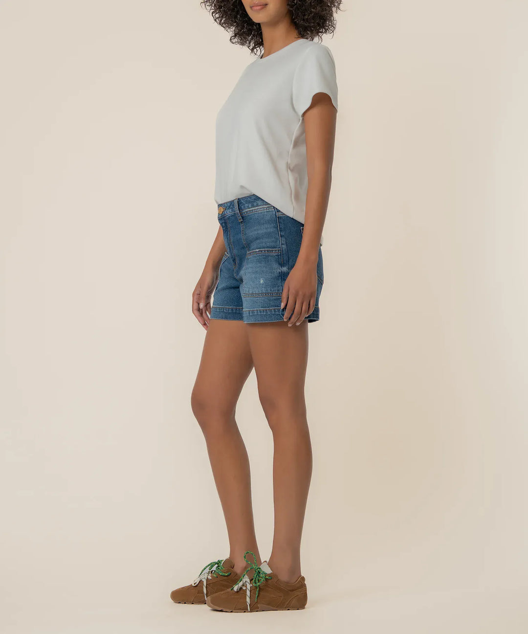 KUT from the Kloth Jane High Rise Denim Shorts with Pork Chop Pockets, showcasing classic blue denim and high waist fit.