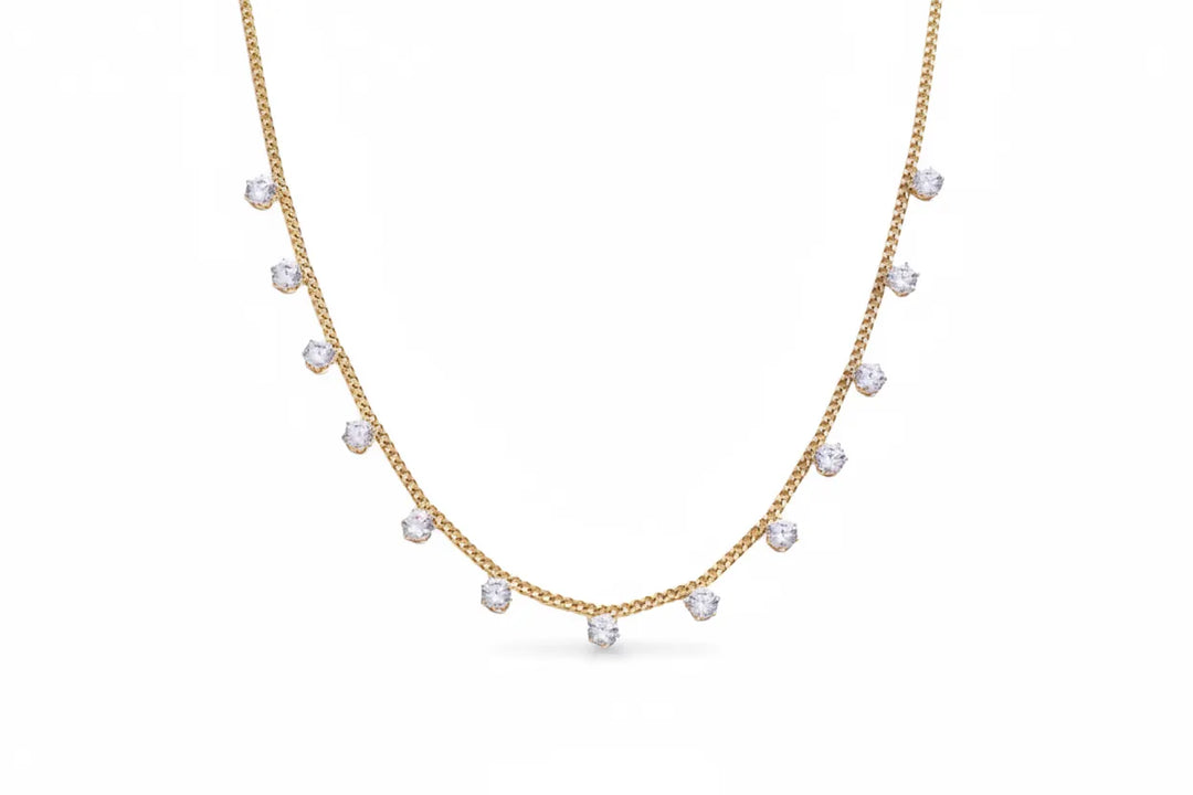 Lauren Kenzie Eloise Necklace featuring a delicate chain and elegant pendant resting on a neutral background.