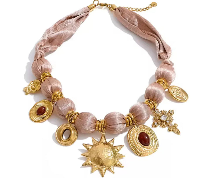 Lauren Kenzie satin mauve charm necklace featuring a delicate chain and elegant charm pendant on a white background.
