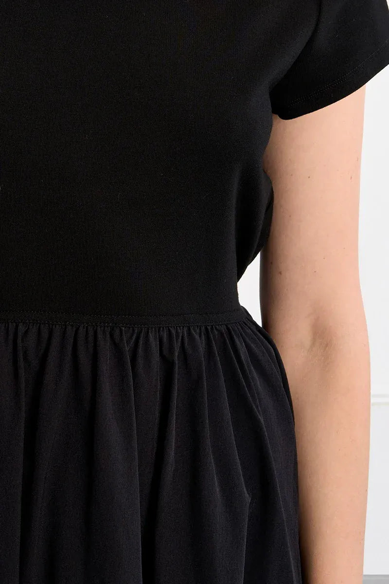 Lili Sidonio Elena drawstring mini dress in lightweight fabric, featuring a fitted silhouette and adjustable waist detail.