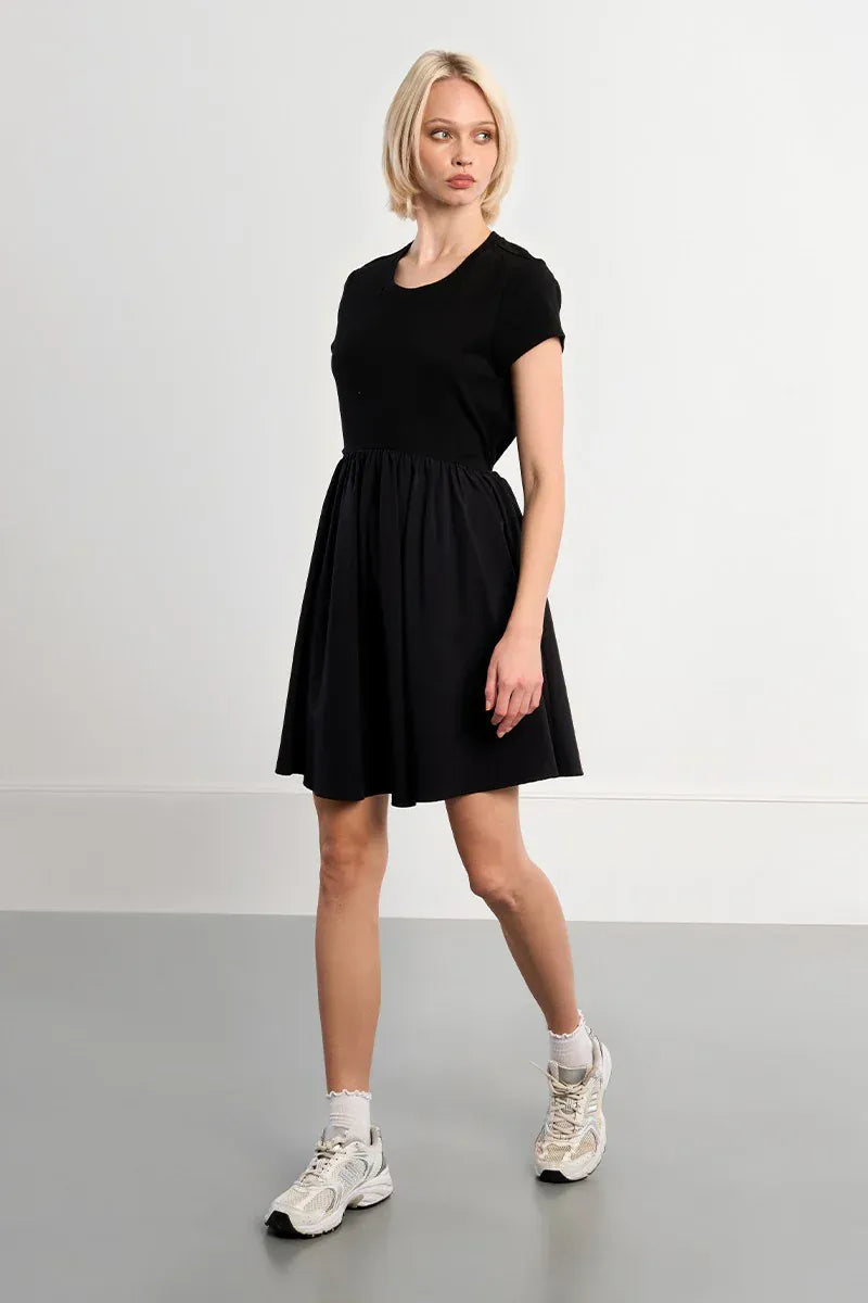 Lili Sidonio Elena drawstring mini dress in lightweight fabric, featuring a fitted silhouette and casual style.
