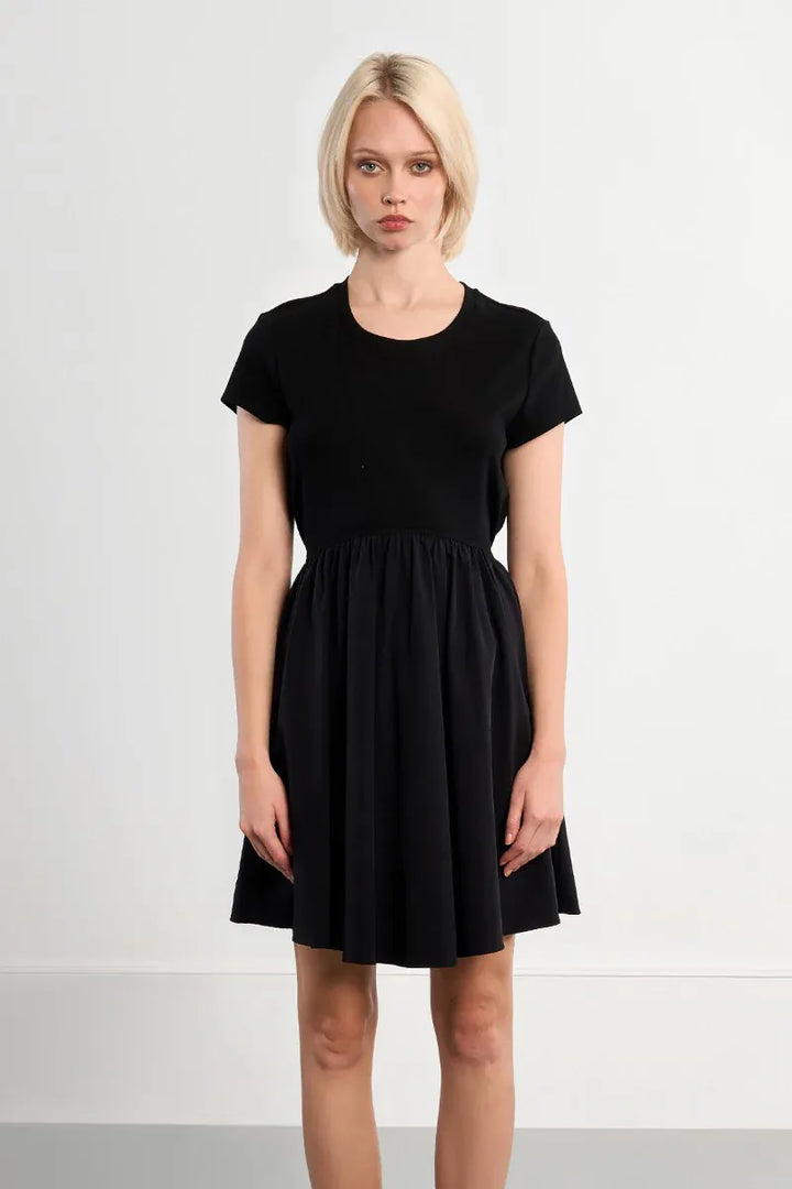 Lili Sidonio Elena Drawstring Mini Dress in lightweight fabric, featuring a stylish drawstring waist and short length.