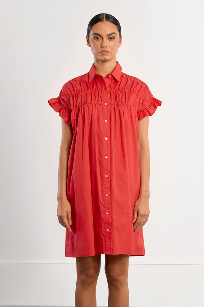 Lili Sidonio Nikki shirt dress featuring a relaxed fit, collar, button-down front, and long sleeves in lightweight fabric.