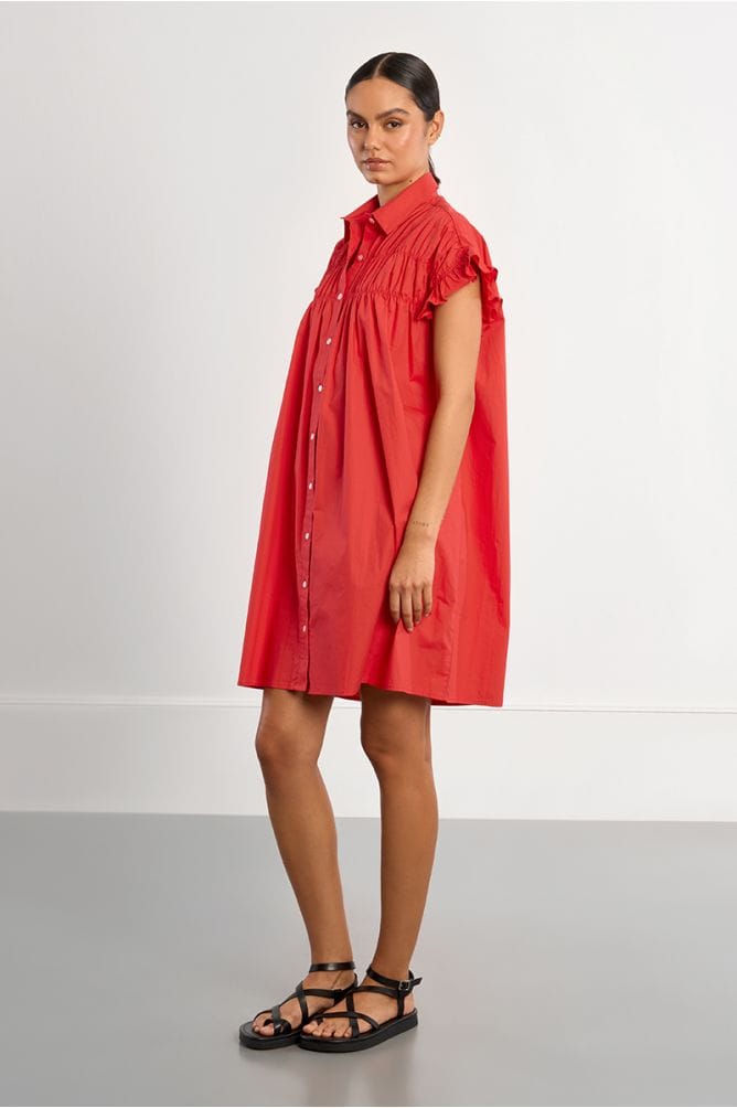 Lili Sidonio Nikki Shirt Dress displayed on a hanger, featuring a classic shirt dress style with button details and a tailored fit.