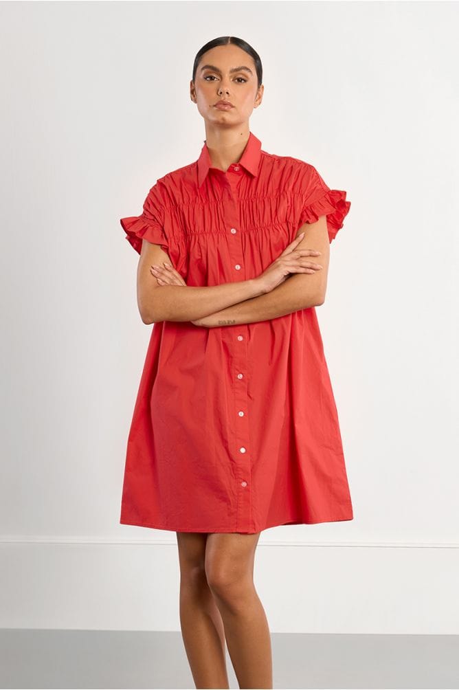 Red Nikki Shirt Dress by Lili Sidonio, shown on a model, featuring a collared neckline and relaxed fit perfect for casual wear.