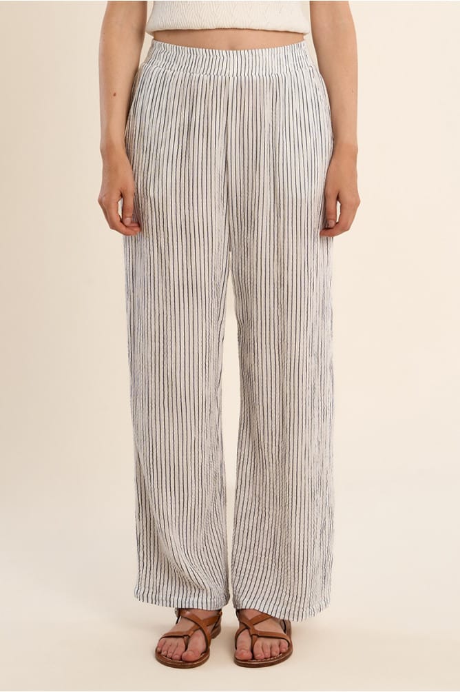 Off-white and navy Leila striped pants by Lili Sidonio, showing the lightweight fabric and stylish pattern.