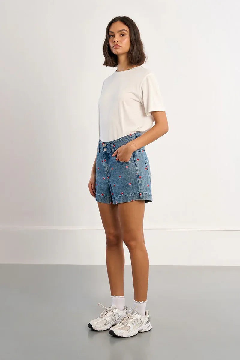 Lili Sidonio Hanna Multi-Hearts Shorts showing colorful heart patterns, casual fit, and lightweight fabric for summer wear.
