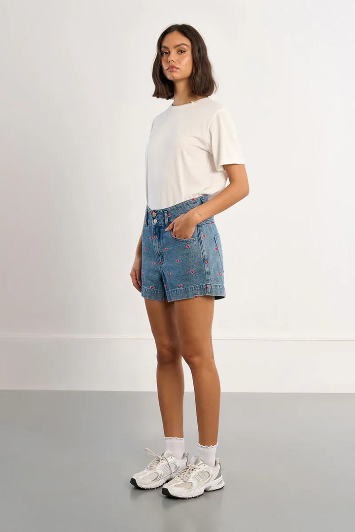 Lili Sidonio Hanna Multi-Hearts Shorts showing colorful heart patterns, casual fit, and lightweight fabric for summer wear.