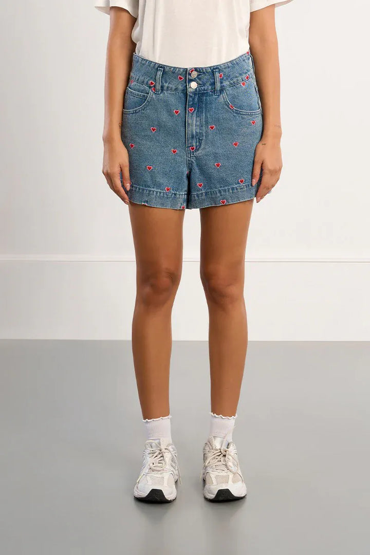 Lili Sidonio Hanna Multi-Hearts Shorts featuring colorful heart patterns and a comfortable, casual fit.