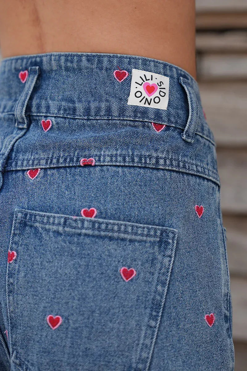 Lili Sidonio Hanna Multi-Hearts Shorts featuring a colorful heart pattern and a comfortable fit, perfect for casual wear.