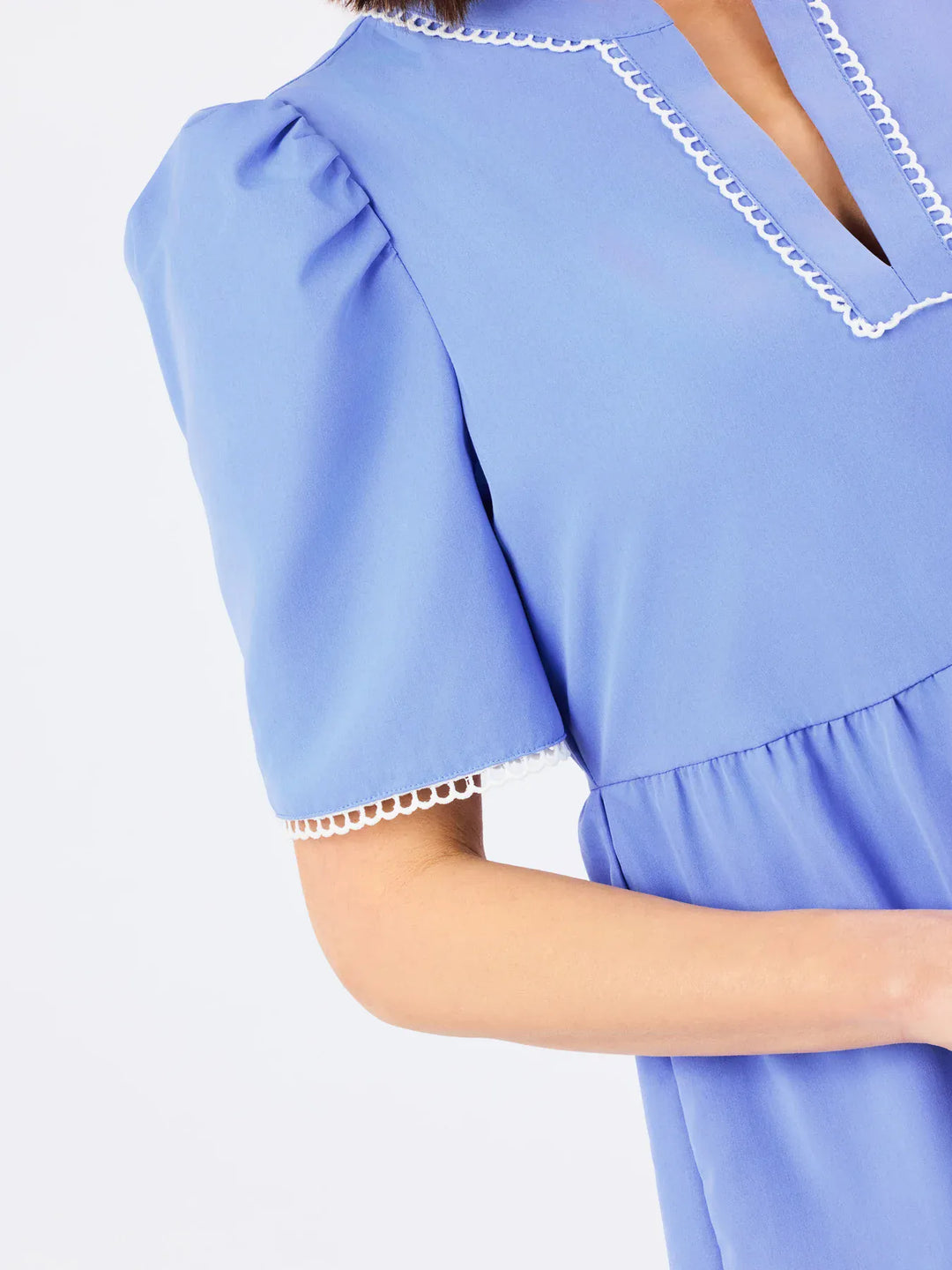 Mary Square Adelyn Midi Dress displayed on a hanger, showcasing its flowy fabric and elegant design.