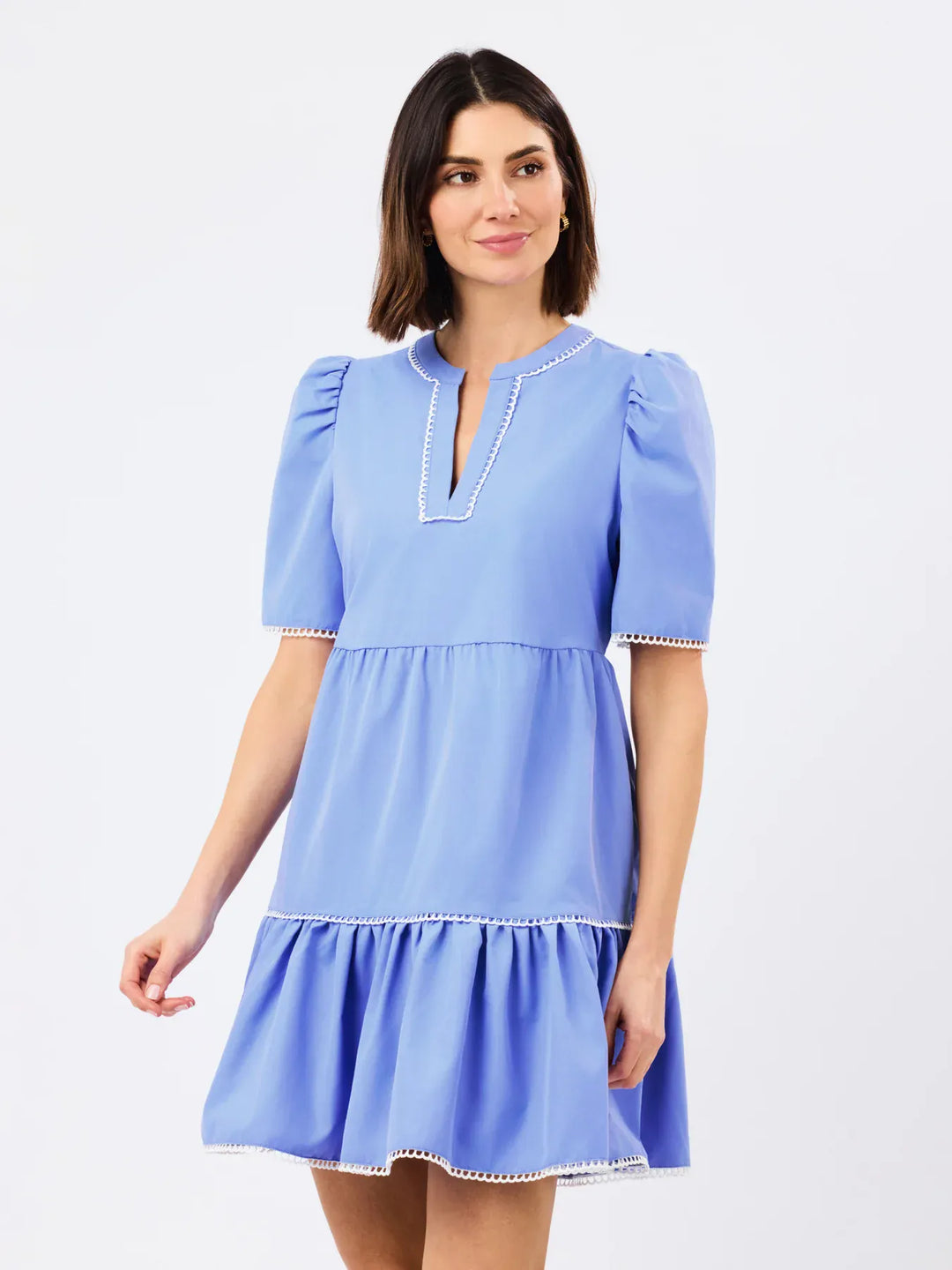 Blue Mary Square Adelyn midi dress displayed on a hanger, showcasing its elegant design and fabric details.