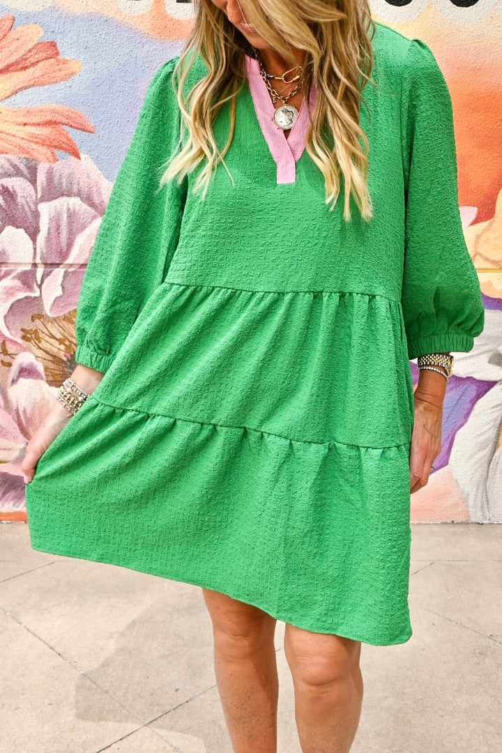 Mary Square Cooper midi dress featuring a stylish, flowy design with a fitted waist and elegant floral pattern.