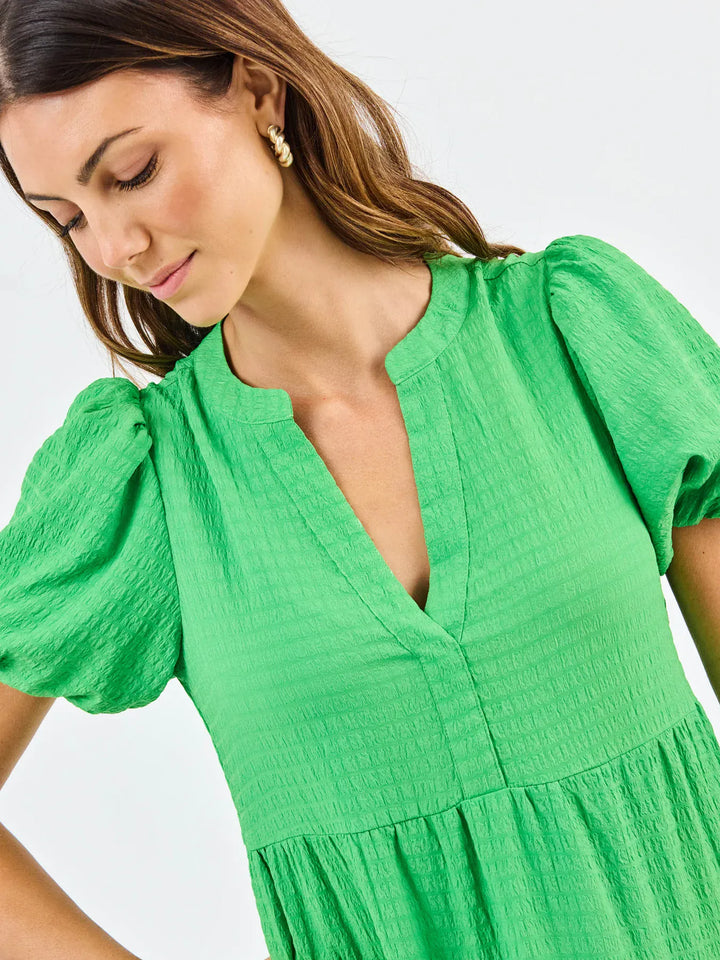 Mary Square Kinsley Midi Dress featuring a flowing fabric, sleeveless design, and floral pattern, perfect for casual or semi-formal occasions.