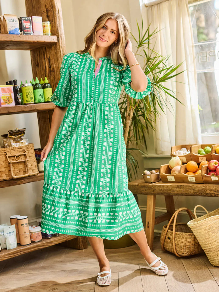 Mary Square Riley Midi Dress featuring a flowy silhouette, floral pattern, and sleeveless design, perfect for casual or semi-formal wear.
