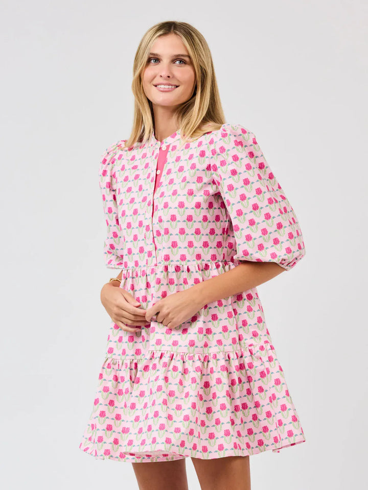 Mary Square Riley Mini Dress featuring a floral print with a fitted neckline and short sleeves in a vibrant, stylish design.