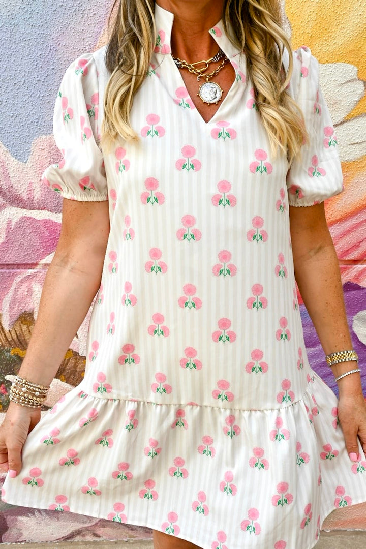 Mary Square Nancy Mini Dress featuring a stylish, fitted silhouette with a floral pattern, ideal for casual or semi-formal occasions.