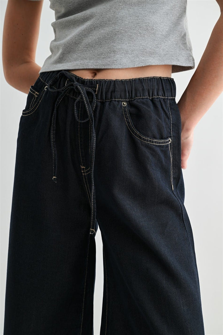 Mica Denim Leah Wide Leg Joggers in denim fabric, relaxed fit with wide legs, stylish casual pants for women.