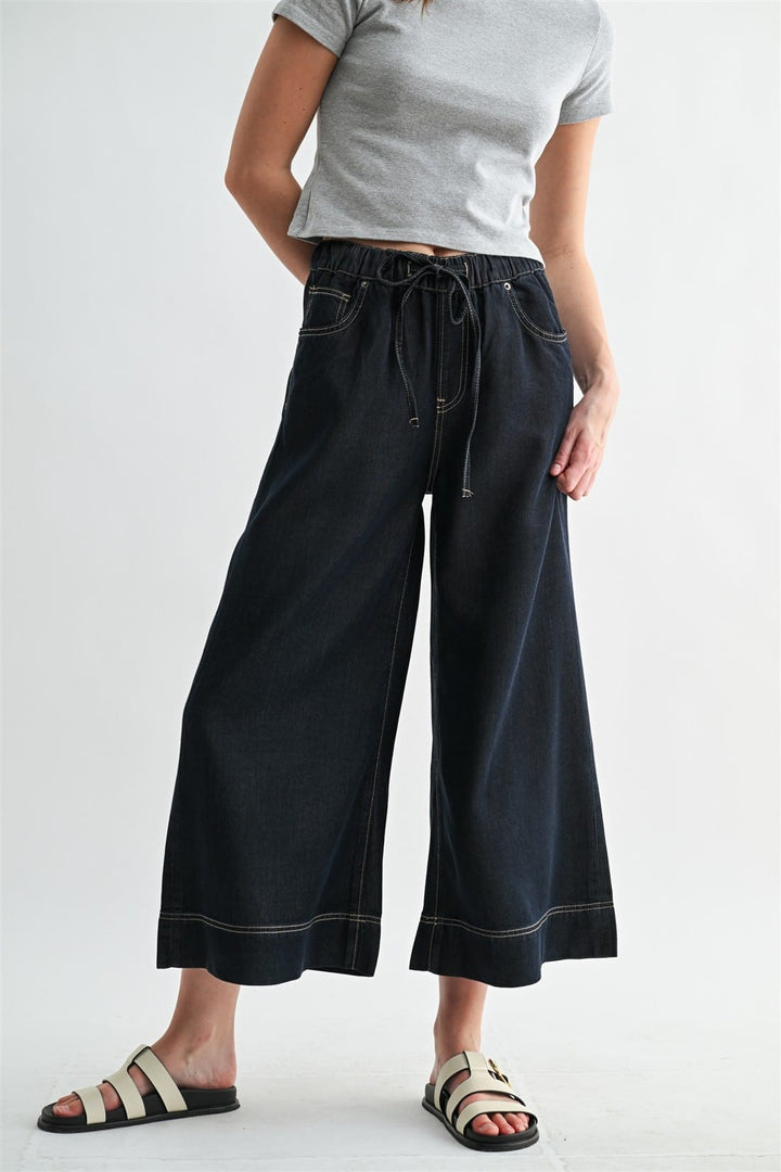Mica Denim Leah Wide Leg Joggers in denim fabric, featuring a relaxed fit and wide-leg design for casual comfort.