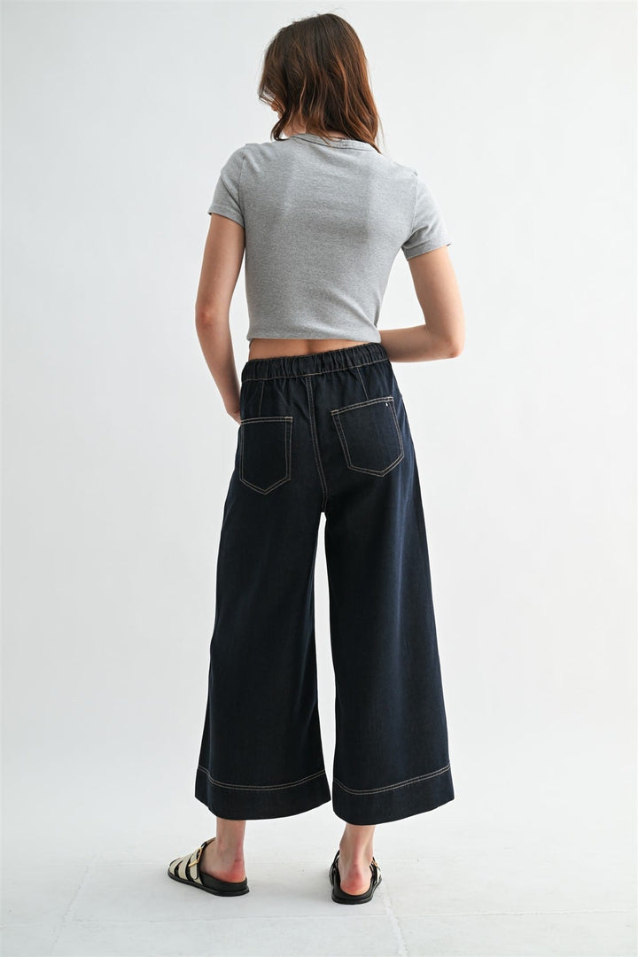 Mica Denim Leah Wide Leg Jogger in denim fabric, showcasing relaxed fit and wide-leg design with visible stitching and pockets.