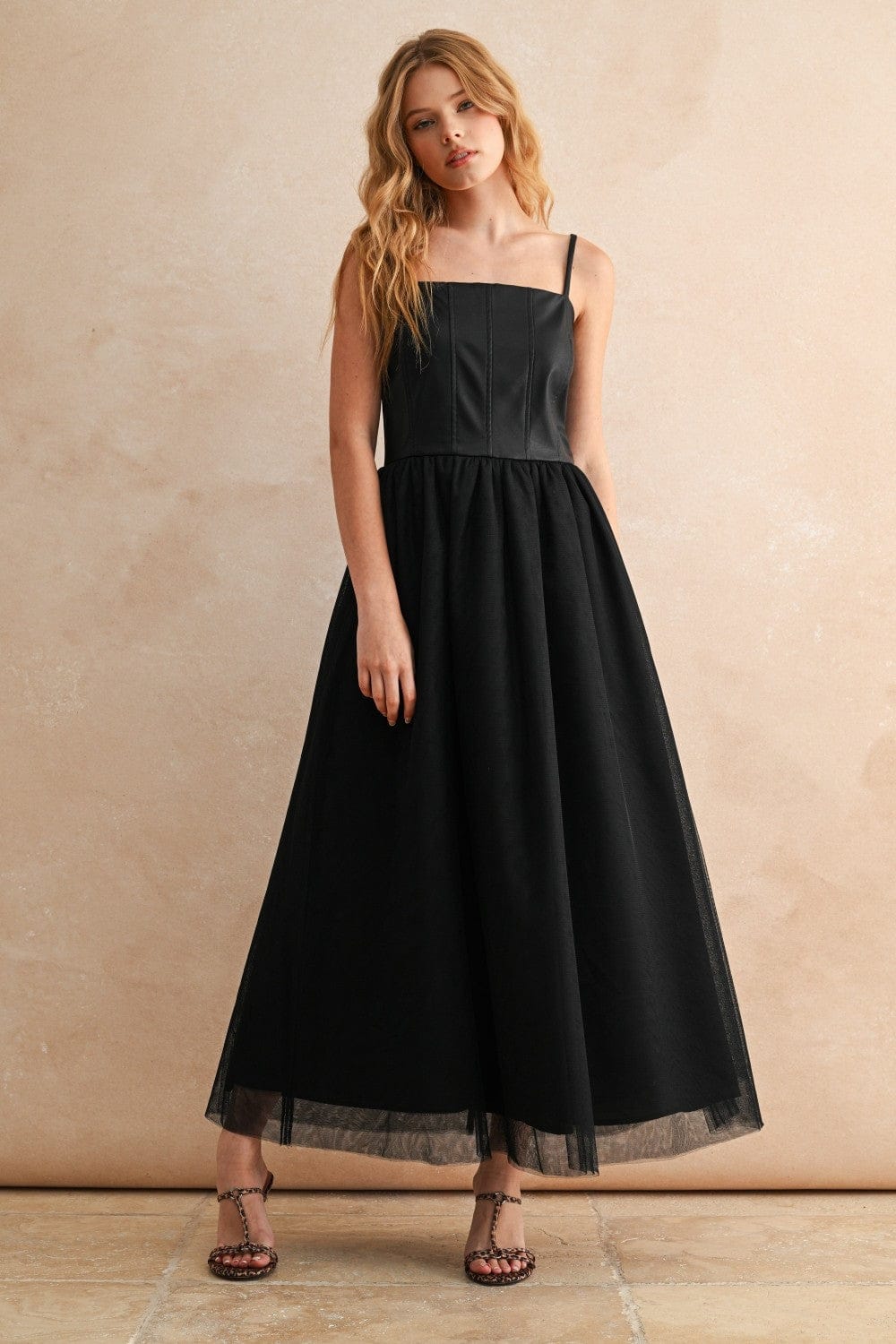 Black Elsie Mesh Skirt Dress by Miou Muse featuring a fitted bodice and flowing mesh skirt for a stylish evening look.