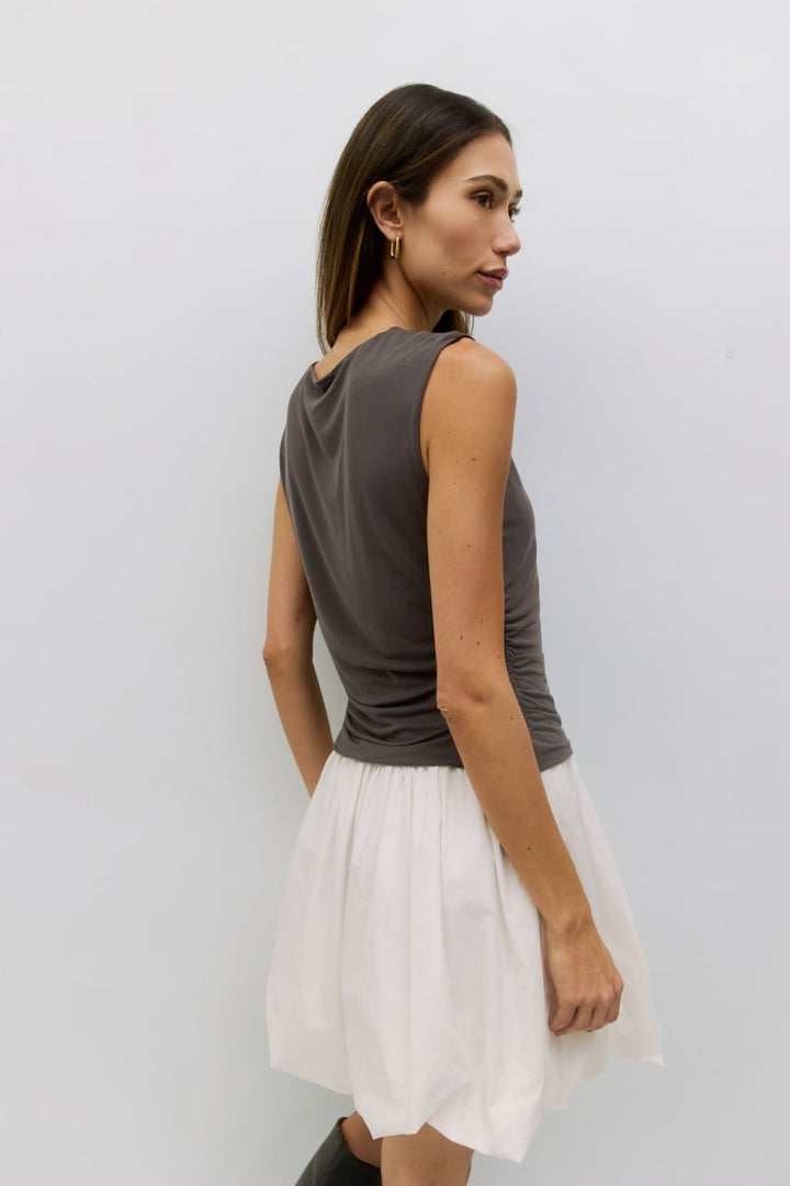 MOD REF Angelique Mini Dress showcasing a stylish silhouette with vibrant fabric and elegant design details.