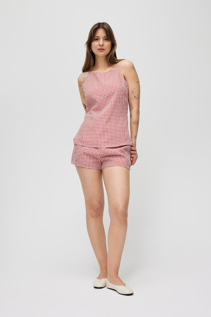 Light blue Madeline Shorts by MOD REF, casual denim shorts with distressed details and rolled hems.