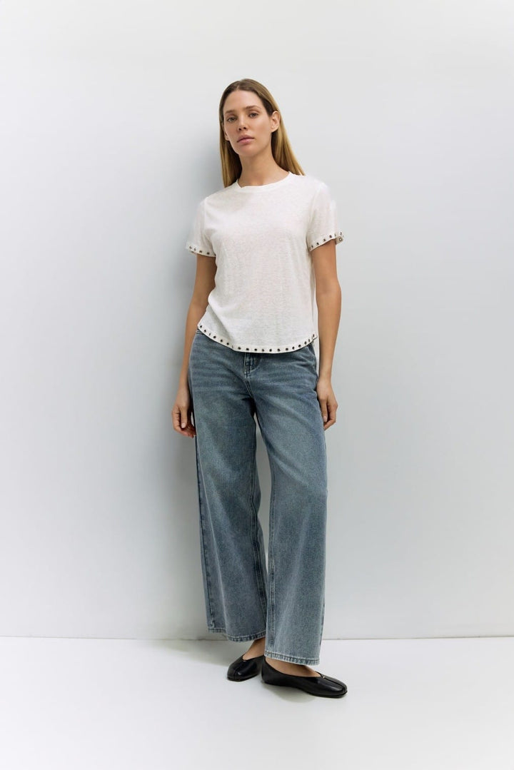 Light beige Zoey Top by MOD REF featuring a relaxed fit and soft fabric, displayed on a hanger.